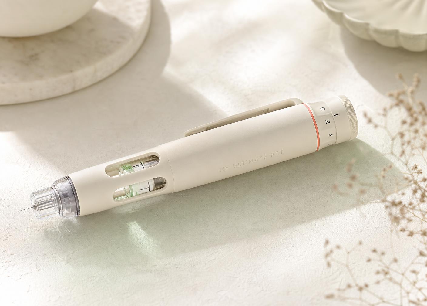 The MY ULTIMATE PET preloaded dual-chamber research pen, resting on a pale stone surface